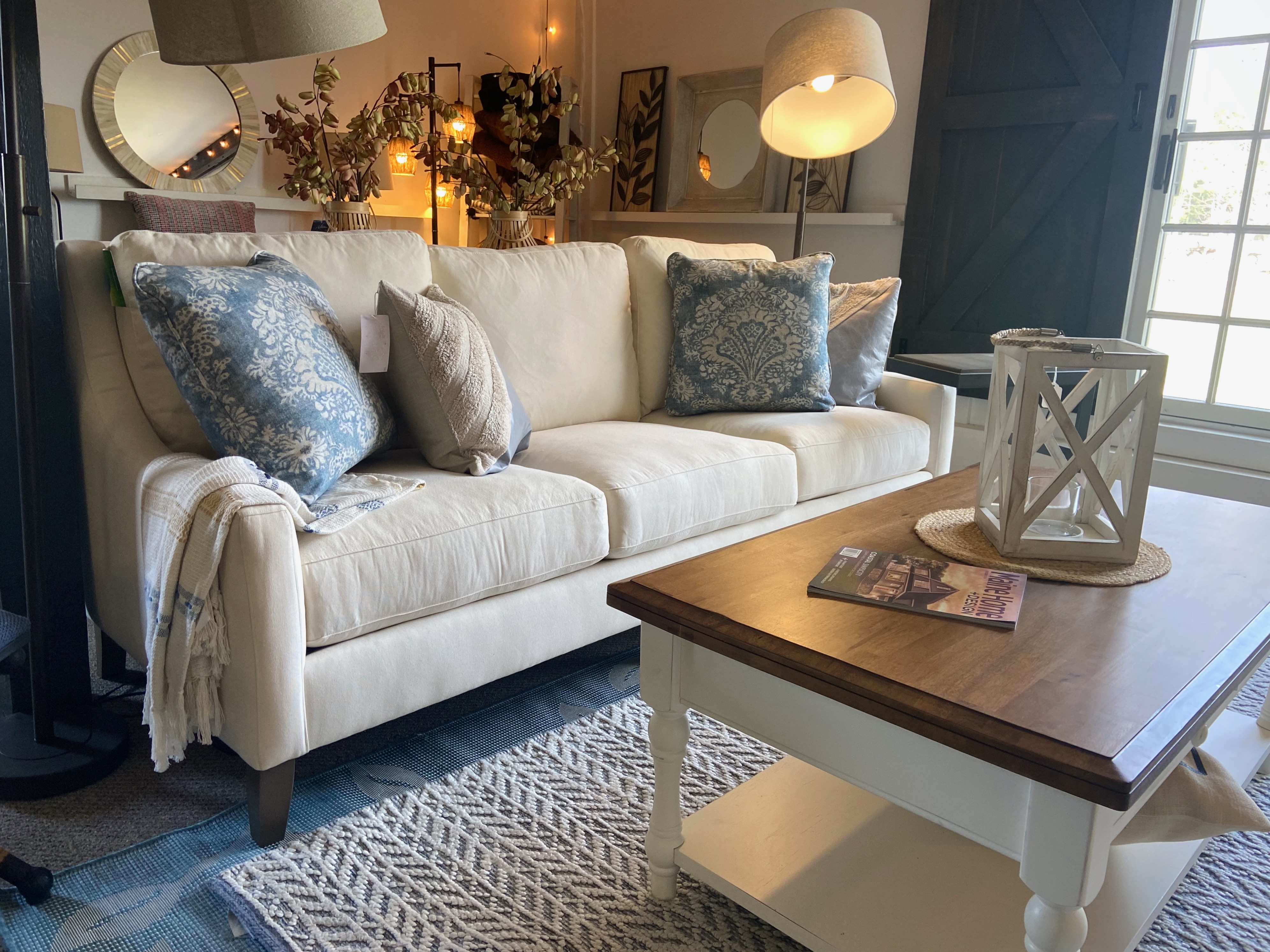 Perry's Home Furnishings & Design showroom featuring a large sofa and pillows