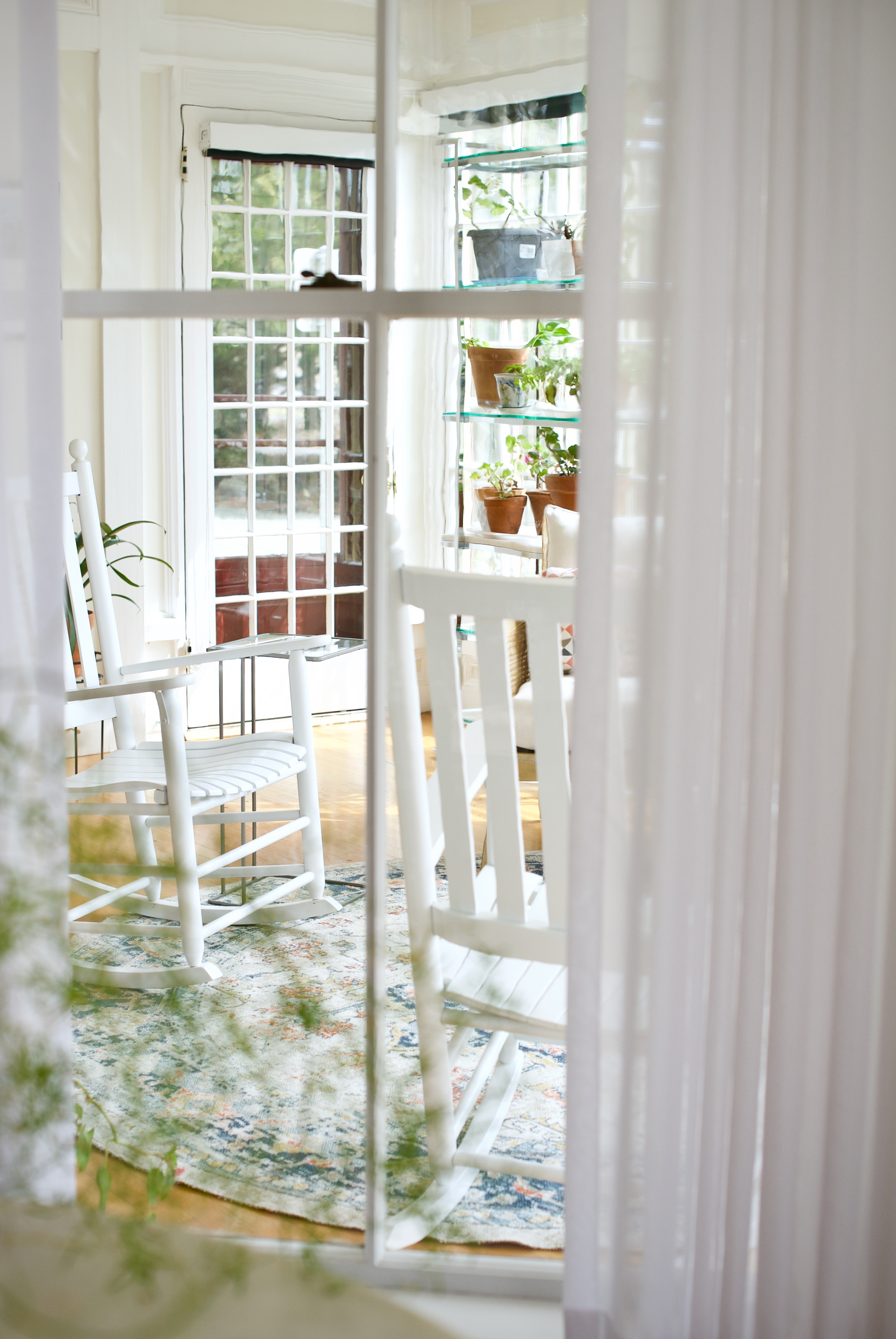 The sun porch of the president's house at the University of Maine Orono campus designed by Perry's Home Furnishings & Design
