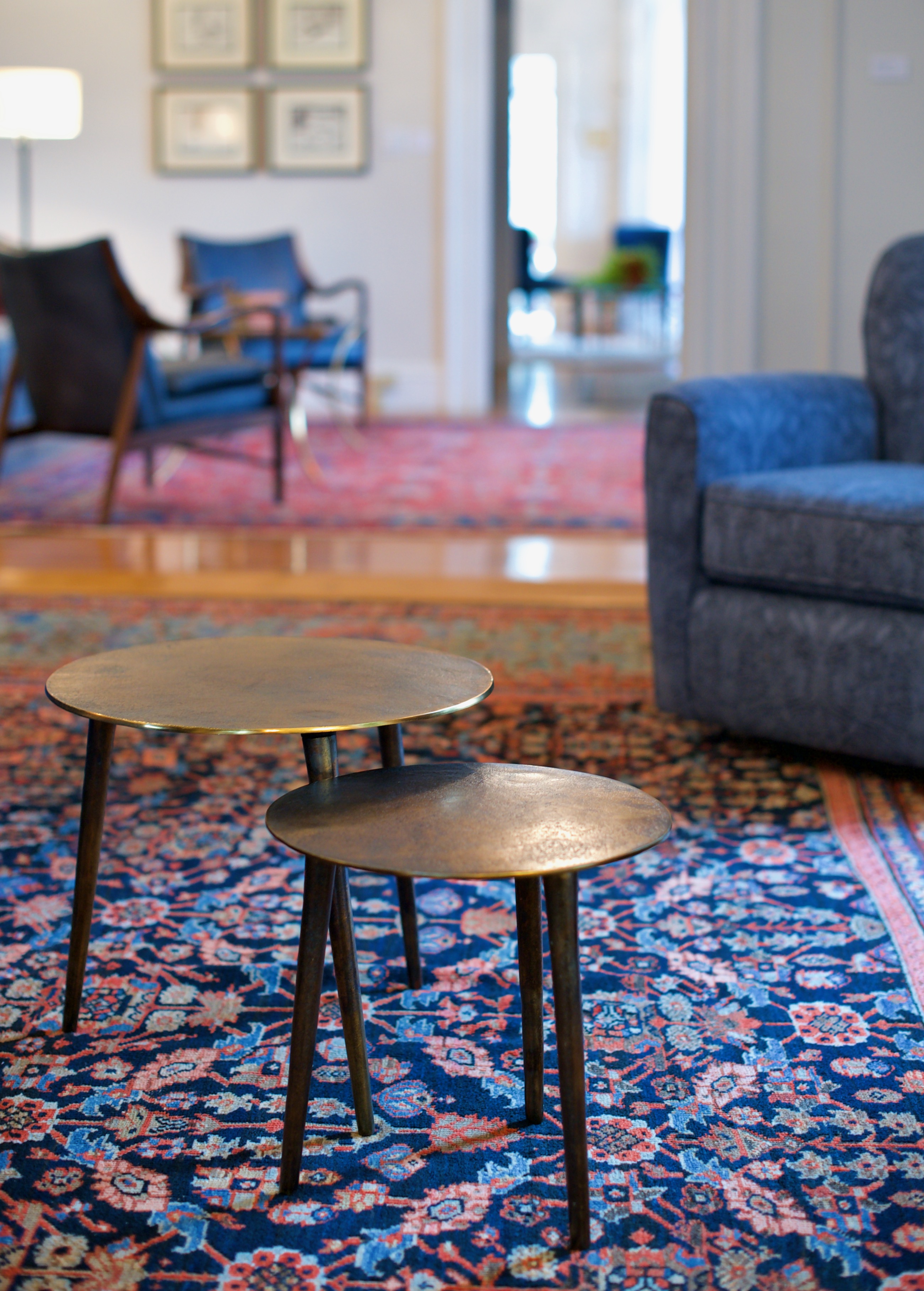 Round accent tables at the president's house at the University of Maine Orono campus designed by Perry's Home Furnishings & Design.